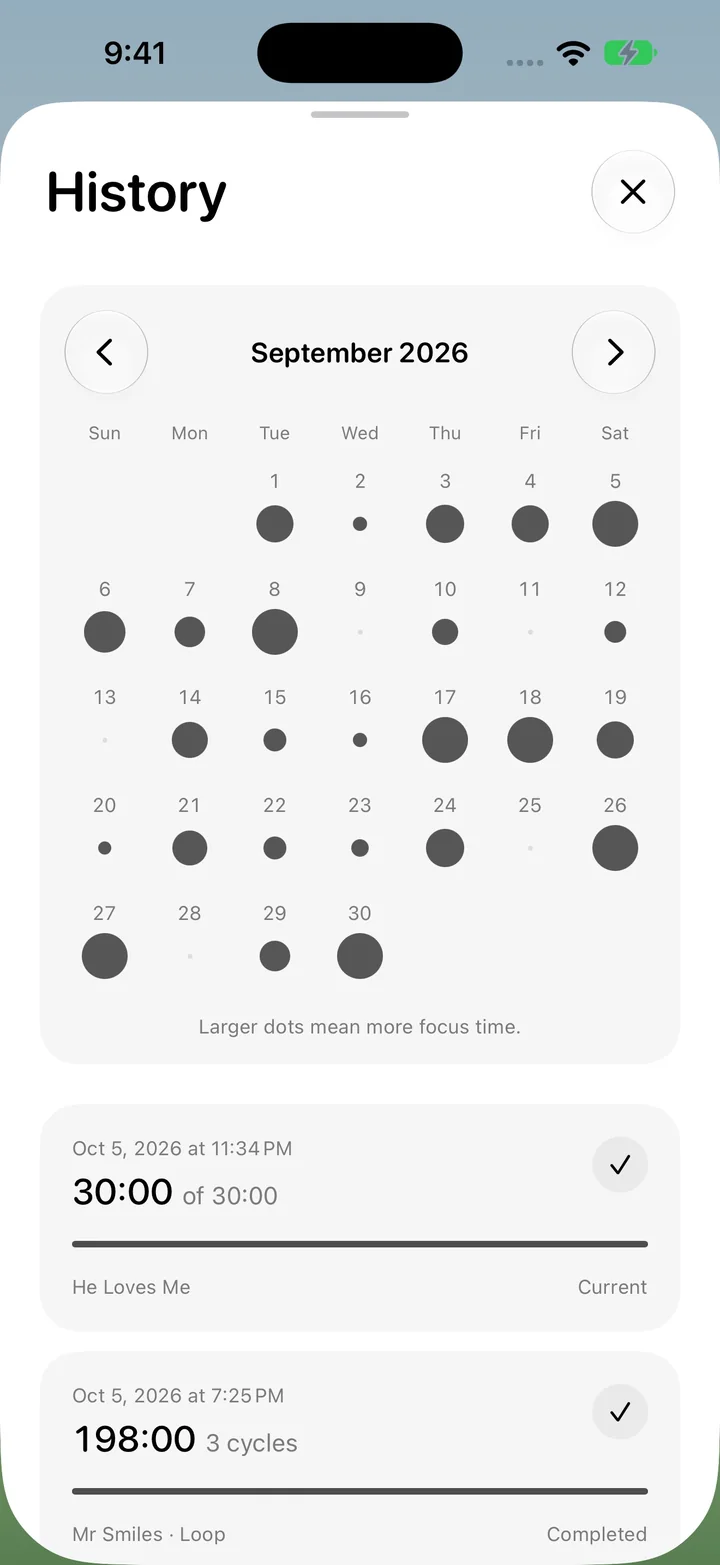 The History screen: a September calendar with a dot under each day, bigger on days with more focus, above a list of past runs.